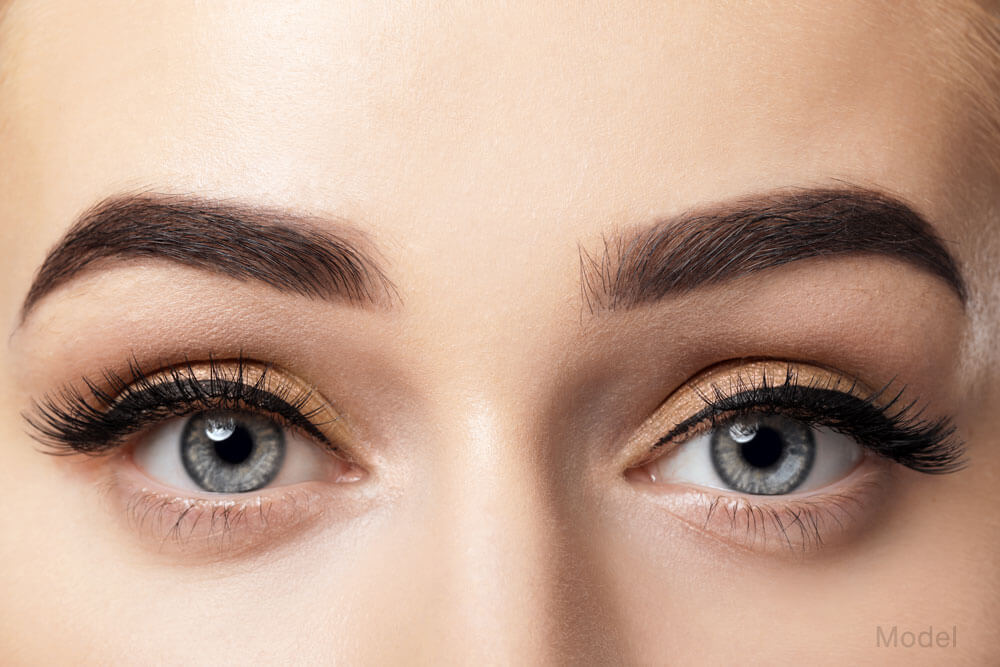 Close up shot of a woman's eyes and symmetrical eyebrows