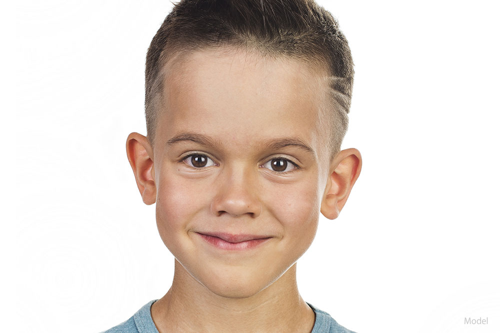 Headshot of a young boy smiling